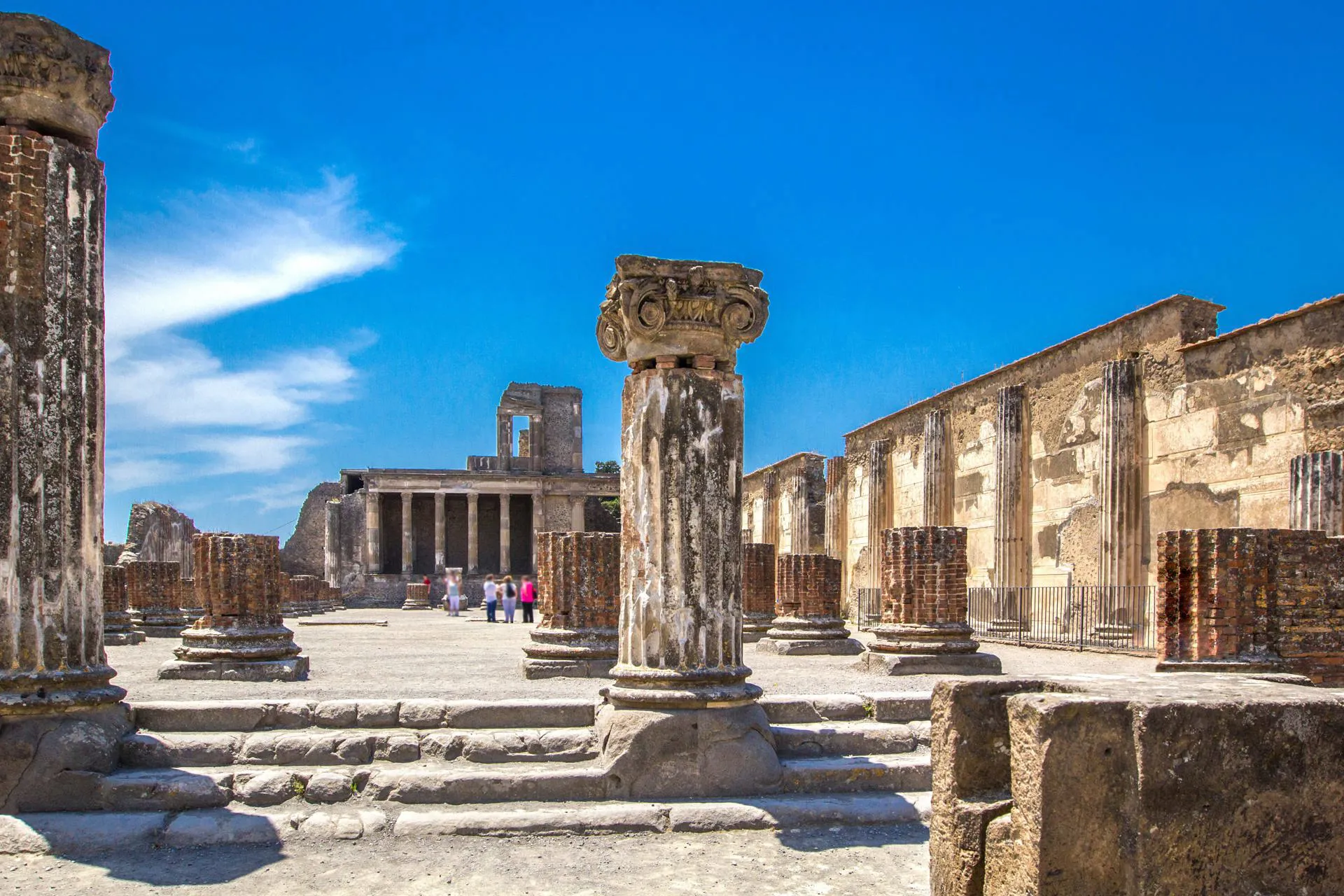 Tourists taking in the atmosphere at the ruins of Pompeii.