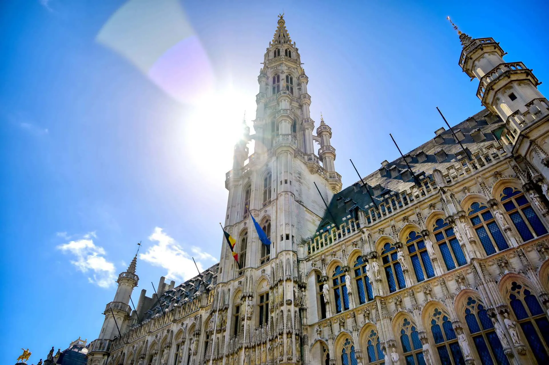 A town hall building in Brussels Square, draped in flags.