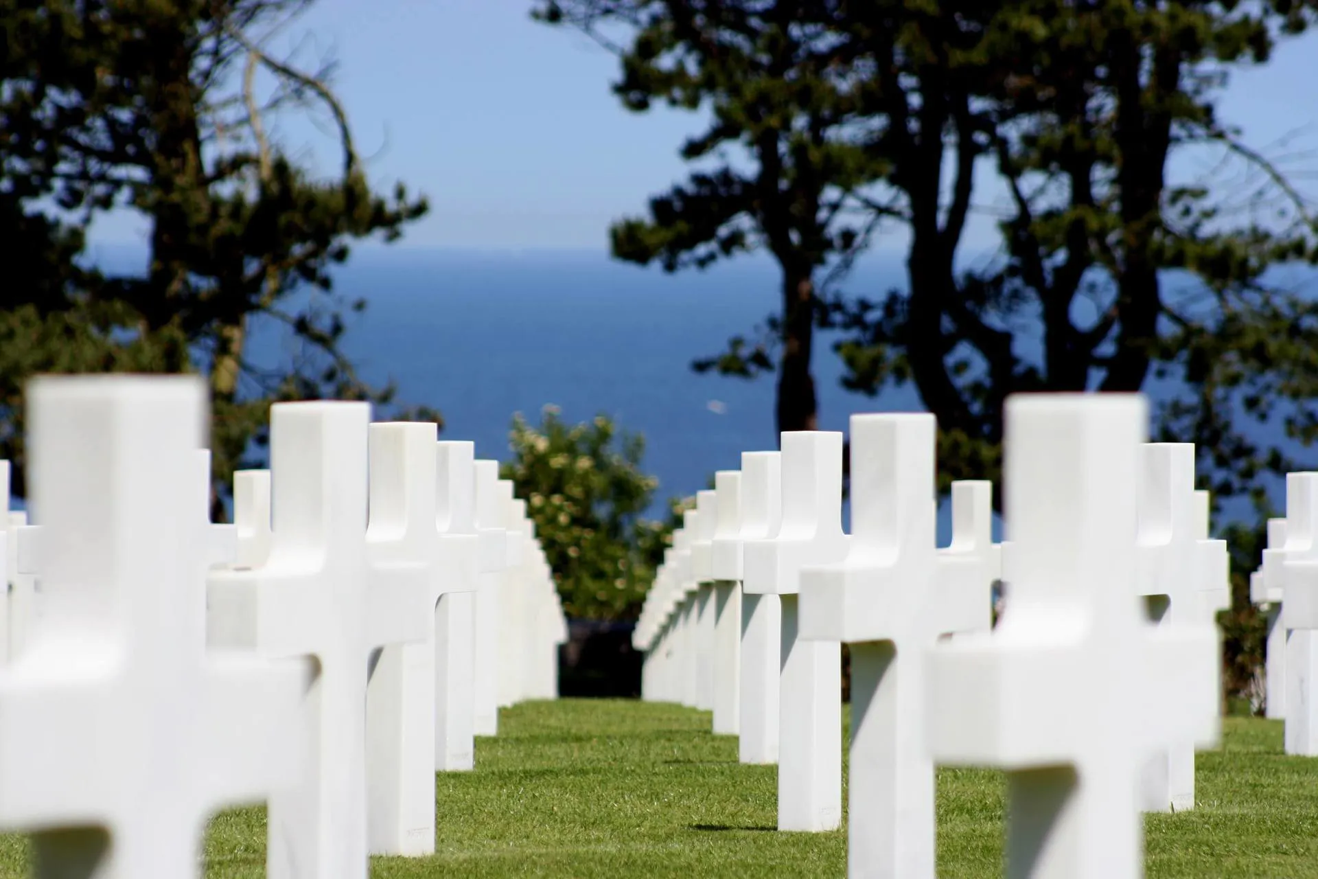 A war memorial cemetery overlooking the ocean in Normandy.