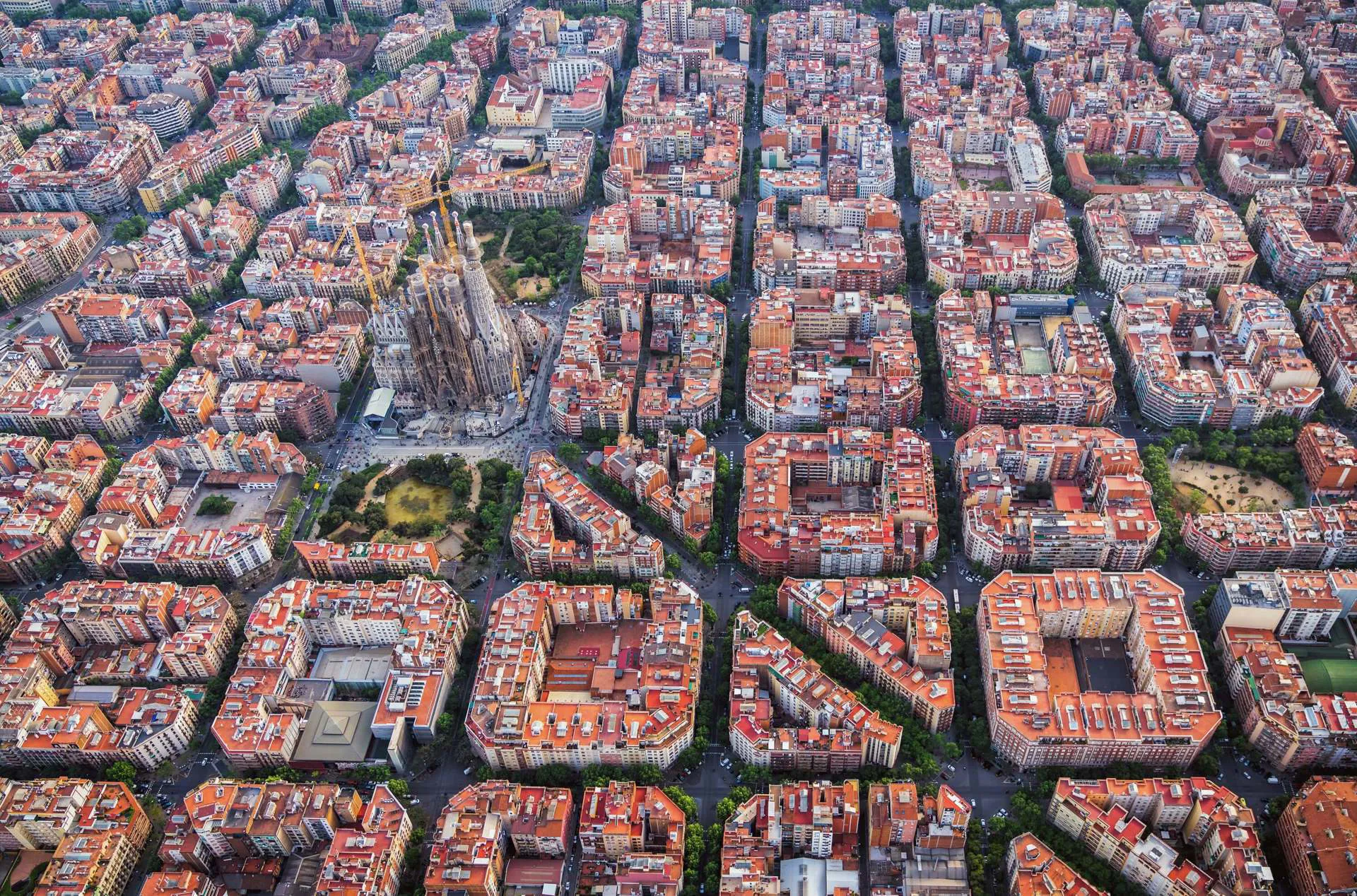 The city of Barcelona seen from the air, with La Sagrada Familia in the centre.