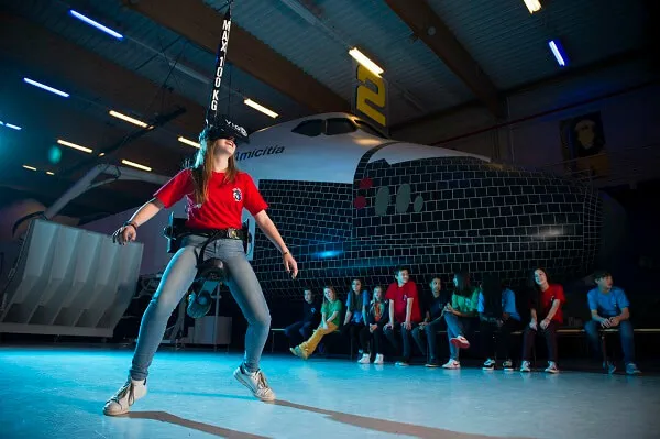 A student in a red shirt takes part in a VR experience in the Euro Space Centre.