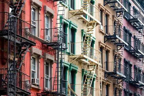 Coloured apartments with staircases on the side in NYC.