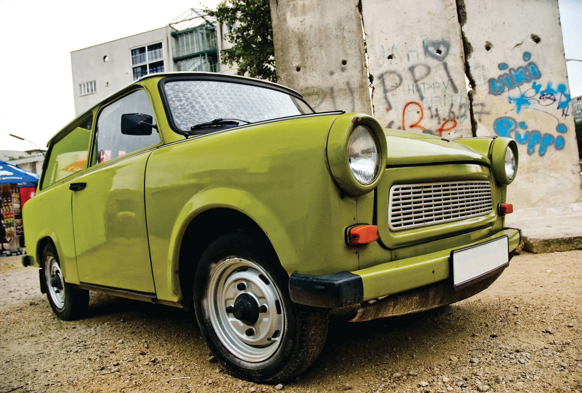 An old trabi car parked on a site in Berlin, Germany.