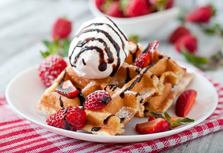 Belgium Waffles With Strawberries And Ice Cream On White Plate Image