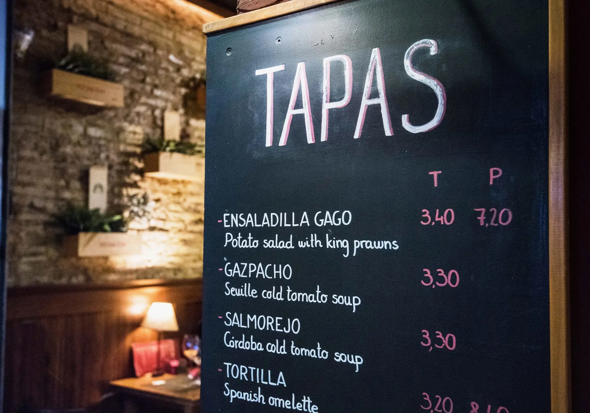 A tapas tasting menu with prices.