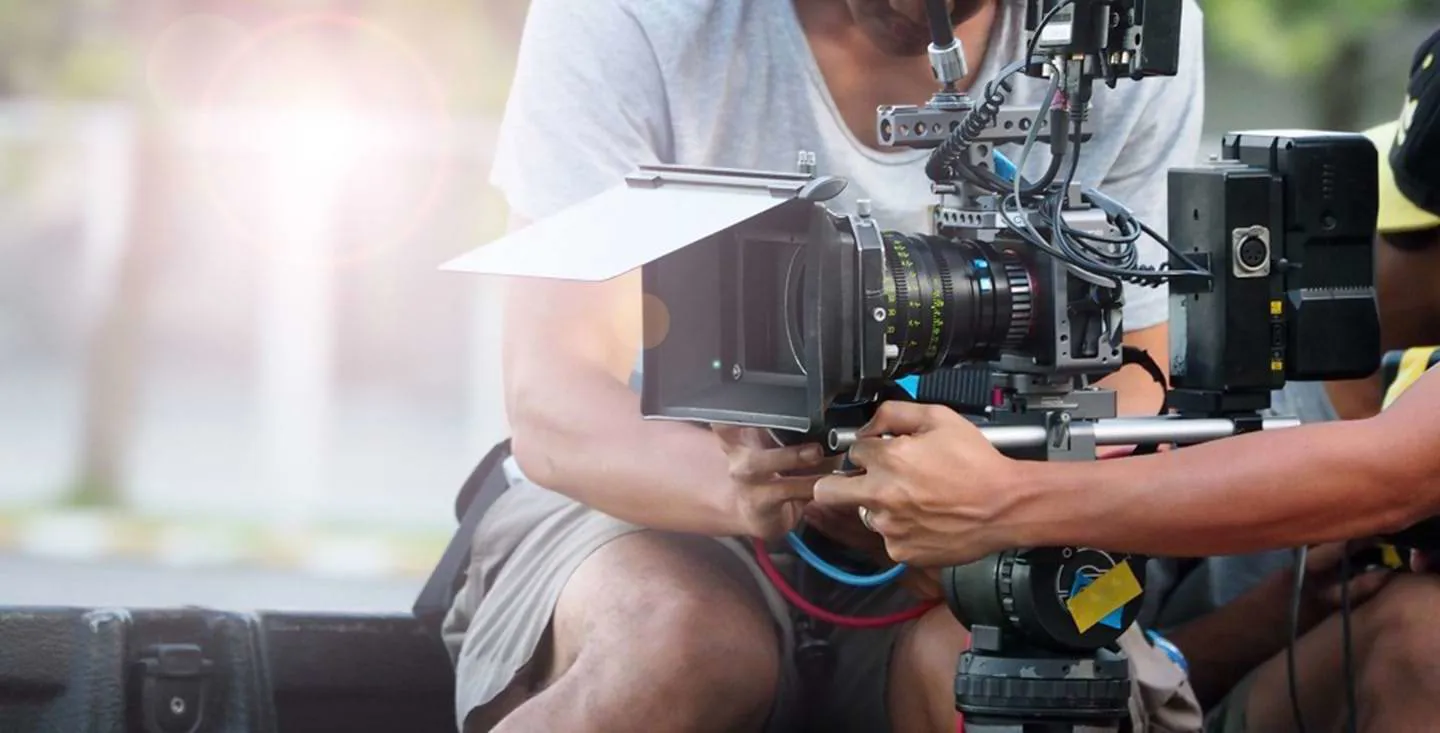 Two people angle a camera ready to shoot a scene for a movie in Barcelona, Spain.