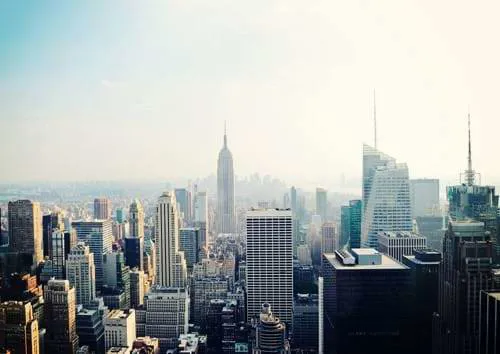 A view of New York City of high rise buildings and the Empire State Building.