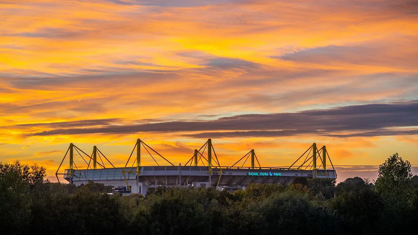 The sun seeting over Signal Iduna Park BVB Dortmund stadium, Borussia Dortmund Football club.