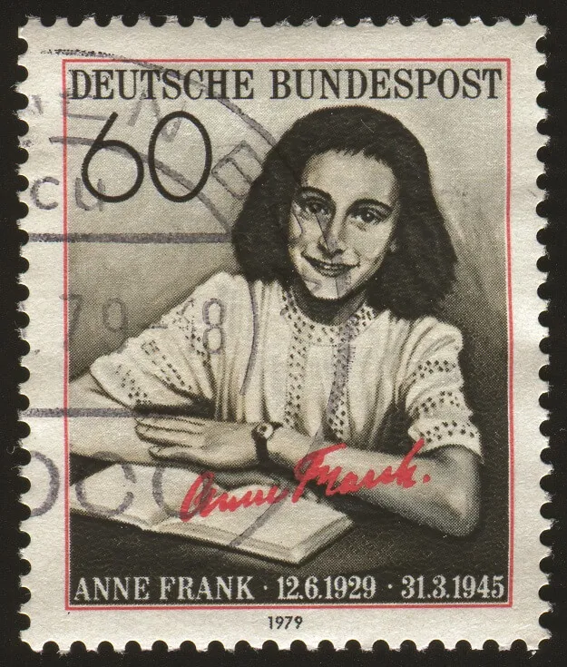 A postal stamp with Anne Frank pictured on it.