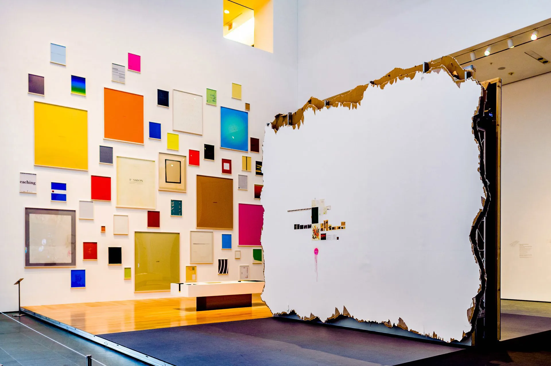 An exhibition of multi-coloured frames and a white canvas within the Museum of Modern Art in New York City, USA.